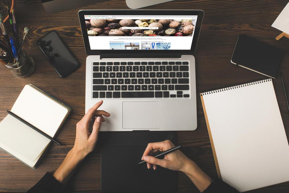 Designer with a graphic tablet and laptop